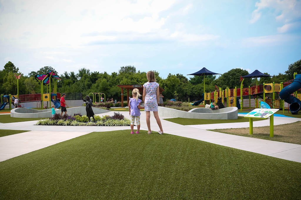 Children playing at the inclusive Makino Park in Mason